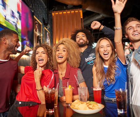 group of friends watching a sporting event