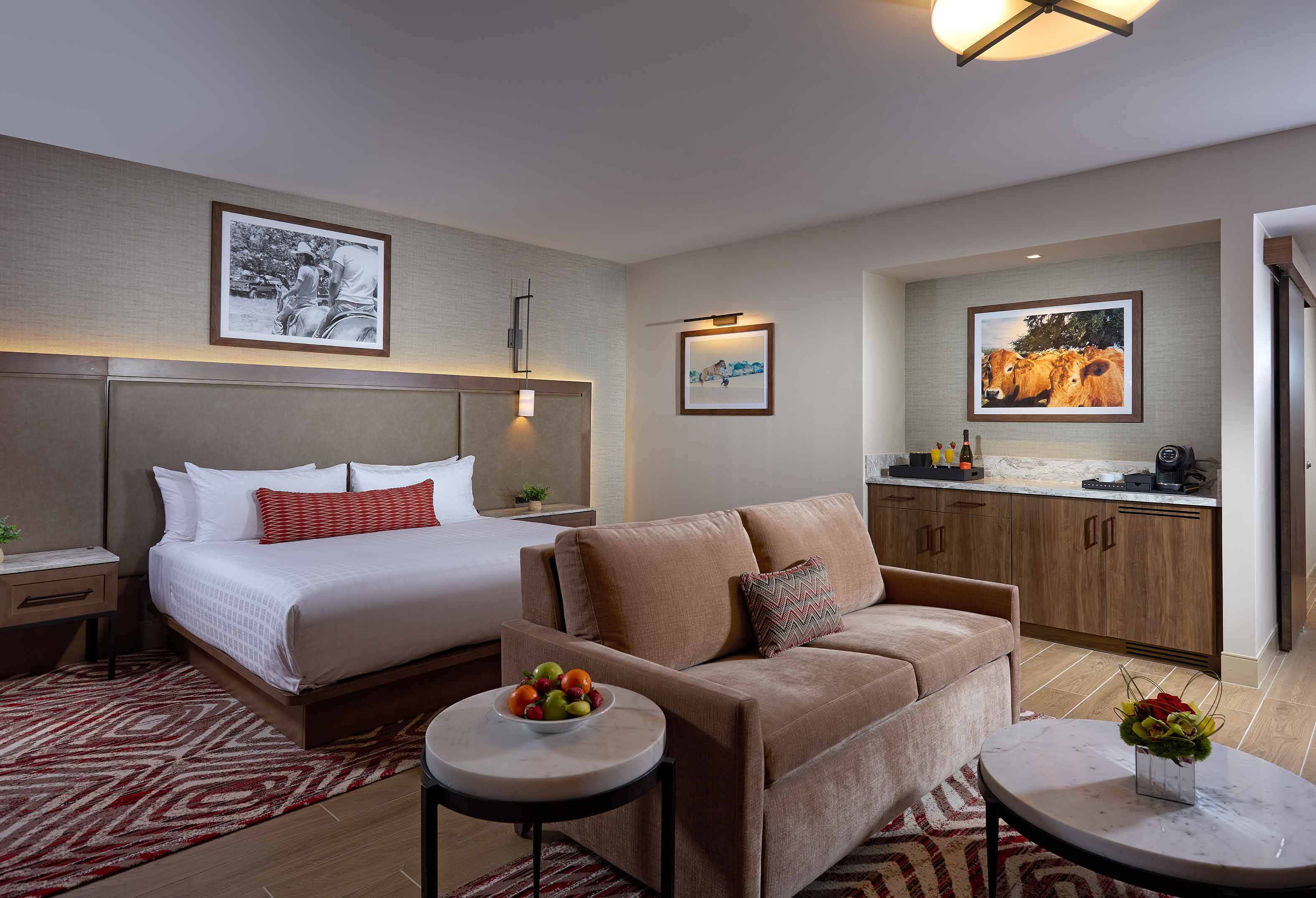 Luxury King hotel room with couch 