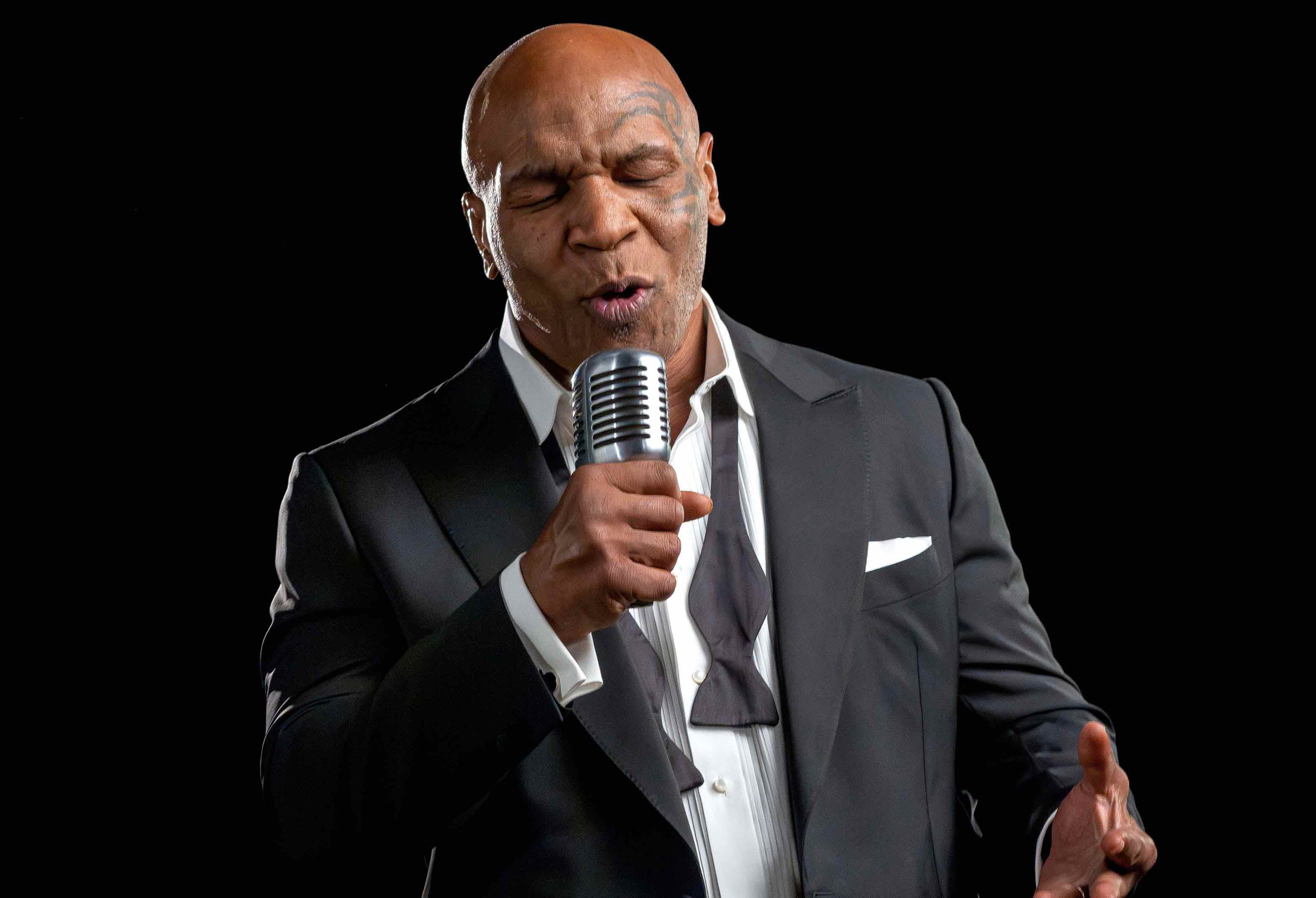 Mike Tyson talking on microphone