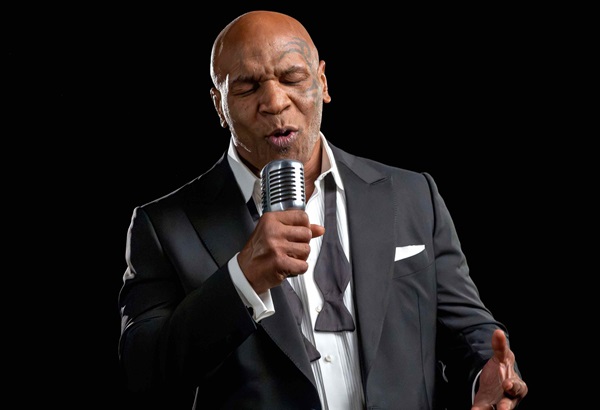 Mike Tyson talking on microphone