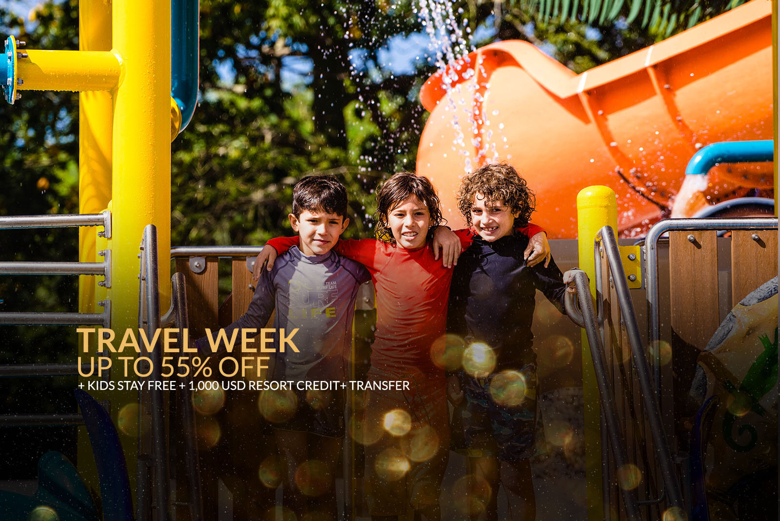 a group of boys standing in front of a water park