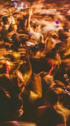 blurry photograph of people dancing at an event