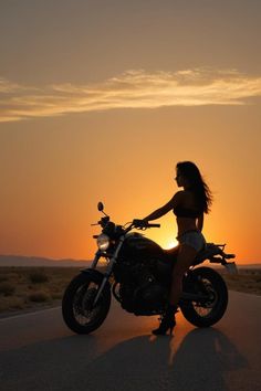 a woman standing next to a motorcycle in the middle of the road at sunset or dawn