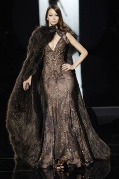 Elie Saab - Fall 2005 Couture https://www.vogue.com/fashion-shows/fall-2005-couture/elie-saab/slideshow/collection#20 Fur Lined Gown, Brown Fur Dress, Fur Gown, Game Of Clothes Gowns, A Game Of Clothes Dresses, Medieval Inspired Fashion Runway, A Game Of Clothes, Fantasy Fur Dress, Lion Fur Cape