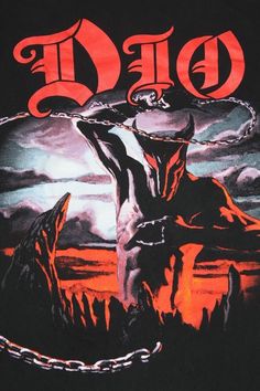 a black shirt with an image of a demon on the front, and chains around it