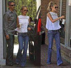 two women and a man are getting out of a car